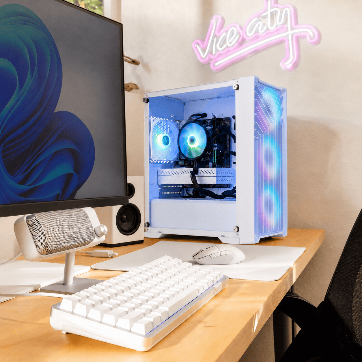 Eclipse V2 white gaming PC on a wood desk setup