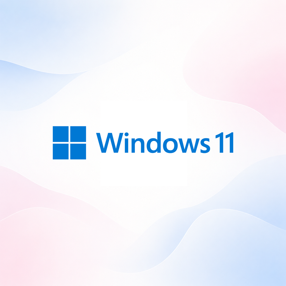 Windows 11 logo on a soft blue and pink gradient background